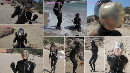 Xiaomeng Latex Breathplay at the Beach - We already forecasted in the last time that after the indoor play we will post an outdoor latex breathplay video. Here it is.
Xiaomeng was wearing her latex catsuit at the beach. It was windy and not warm, but her breathplay activities made her really hot and sweat quite a lot under her latex skin. We had a lot of fun there.
	She was wearing a vintage oval diving mask and a ball gag. She can only breathe through the ball gag and started drooling very quickly.
	The ball gag was replaced by tape, and she cant breathe anymore.
	Combination of the ball gag and a breathplay hood. The heat, sweat and saliva made the hood very sticky, and Xiaomeng went crazy under the sun after wearing it over 8 minutes, even though the hood has a small breathing hole.
	We were so upset that some tools were swept to the sea by a big wave but after a few minutes they all came back!
	A gas mask and a rebreather bag with a pump. She was asked several times to walk away until she exhausted all her air, and then to come back. Is that a mission impossible?
	The same walking-away-and-coming-back game, but with a latex breathplay hood and the ball gag instead. This time there is no breathing hole on the hood!
	At the end we continue with the breathplay hood with no hole for several time, until Xiaomeng was totally exhausted.
Breathplay in nature looks beautiful, isnt it? We hope you enjoy the sun and the beach too!